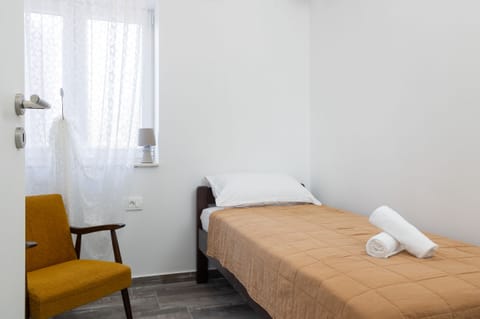 Second bedroom with single bed, A/C, wardrobe closet