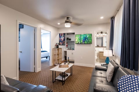 Suite, Balcony | Individually furnished, laptop workspace, blackout drapes, free WiFi