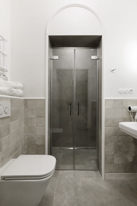 Standard Apartment | Bathroom | Hair dryer, towels, soap, toilet paper