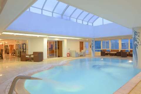 Indoor pool, open 10:00 AM to 6:00 PM, sun loungers