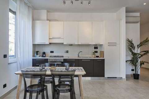 Comfort Apartment, 2 Bedrooms | Private kitchen | Full-size fridge, oven, stovetop, dishwasher