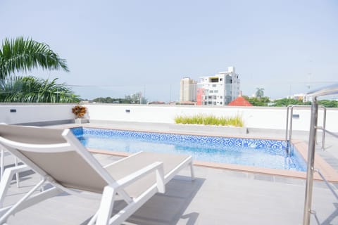 Outdoor pool, open 8:00 AM to 10:00 PM, pool umbrellas, sun loungers