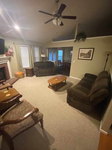 Living room with a recliner and reclining couch.