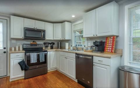 Dishwasher, microwave, stove, and needed cooking supplies.