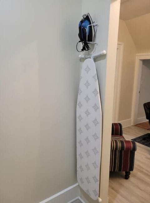 2nd floor, laundry area with iron and ironing board 