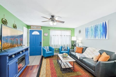 Welcome to our home! Enjoy the artsy, colorful,  boho living room 