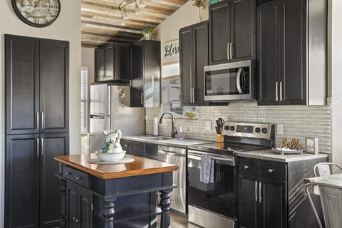 Whip up a delicious meal in the fully equipped kitchen - the heart of your cozy condo that's sure to inspire your inner chef!