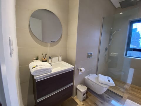 Luxury Condo | Bathroom | Rainfall showerhead, bathrobes, towels