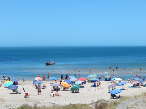 On the beach, beach umbrellas, beach towels, beach bar