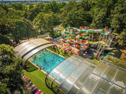 Dive into fun at Les Ajoncs d’Or, where families enjoy a vibrant outdoor pool surrounded by exciting water slides for all ages.