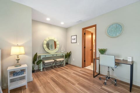 Bedroom 2 with desk area and vanity.