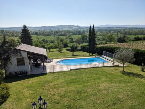 View from bedroom window over the pool, outdoor kitchen and valley