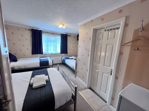 Deluxe Quadruple Room, Multiple Beds | Desk, iron/ironing board, free WiFi