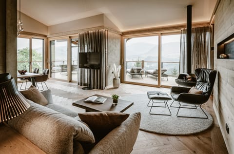 Luxury Penthouse | Living area | 58-inch flat-screen TV with cable channels, TV