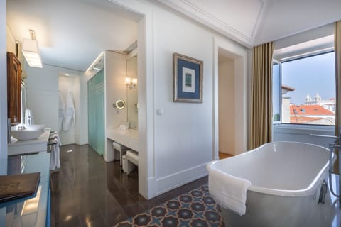 Panoramic Suite | Bathroom | Rainfall showerhead, designer toiletries, hair dryer, bathrobes