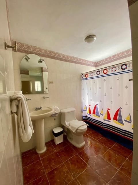 Family Room | Bathroom | Combined shower/tub, soap, toilet paper