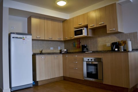 Apartment, 1 Bedroom | Private kitchen | Full-size fridge, microwave, oven, stovetop