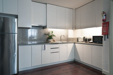 Three-bedroom condo | Private kitchen | Fridge, electric kettle