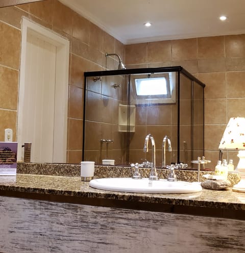 Suite Sereno | Bathroom | Designer toiletries, hair dryer, towels, soap