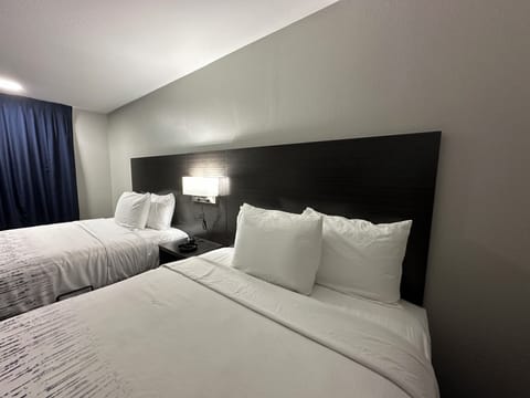 Deluxe Room, 2 Queen Beds, Smoking, Refrigerator & Microwave | Premium bedding, pillowtop beds, laptop workspace, blackout drapes