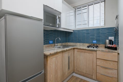 One Bedroom Apartment | Private kitchen | Full-size fridge, microwave, stovetop, electric kettle