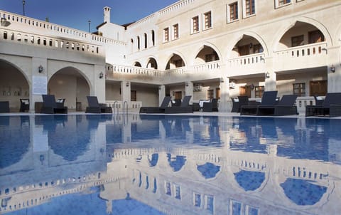 Indoor pool, outdoor pool, pool umbrellas, sun loungers