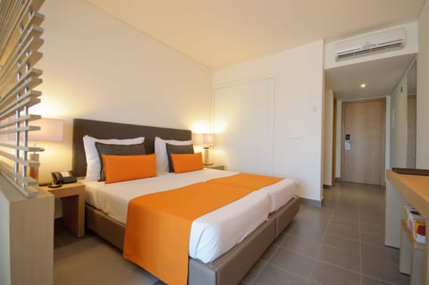 Superior Room, Partial Ocean View | Minibar, in-room safe, free WiFi, bed sheets