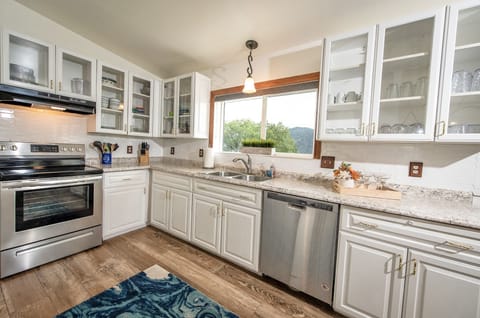 Fully equipped kitchen with electric stove