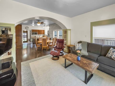 Cozy living room with smart tv, some books and games. 