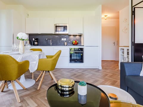 Furniture, Table, Property, Cabinetry, Interior Design, Wood, Couch, Yellow, Flooring, Floor