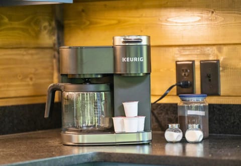 Everything you need within arm's reach in our charming kitchen, from a morning cup to a quick wifi connection, making your stay as seamless as it is serene