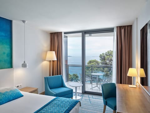 Deluxe Double or Twin Room, Balcony, Sea View | Minibar, in-room safe, desk, soundproofing