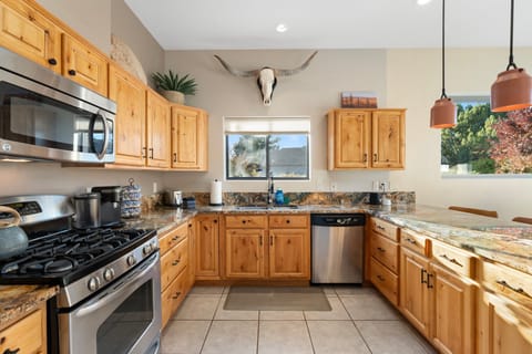 Fully equipped kitchen with Keurig coffee machine, fridge, dishwasher, microwave