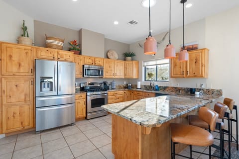 Fully equipped kitchen with Keurig coffee machine, fridge, dishwasher, microwave