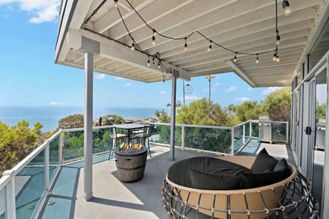 Breathtaking ocean views and a cozy setup to match—this round wicker chair and bar table set are made for moments of relaxation on the wraparound balcony. The perfect place to watch the waves and enjoy the breeze.