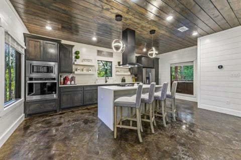 This beautifully designed kitchen is both functional and elegant, equipped with everything needed for the gourmet chef or casual cook to create culinary delights.