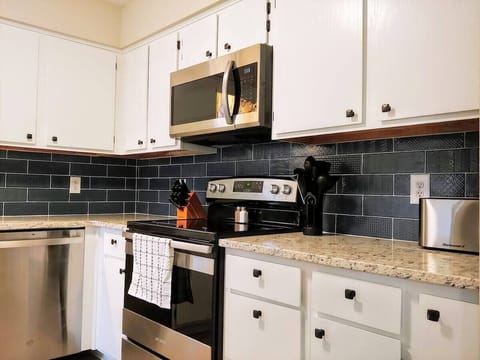 Enjoy cooking up a family meal in the fully stocked kitchen! (kitchen of 4-bedroom home shown)