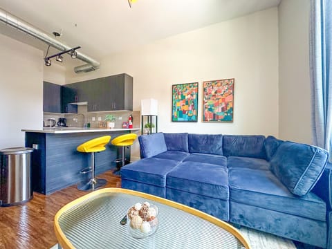 Spacious living room with a lot of natural light and large windows.