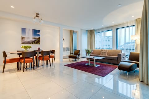 Deluxe Suite, 2 Bedrooms, Balcony | Living area | LCD TV, heated floors