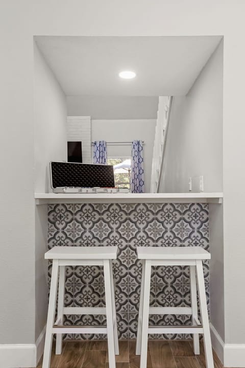 Unwind and chat with friends or family at our chic kitchen bar, a central hub for conversation and enjoying snacks or drinks.