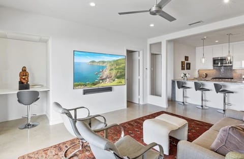 Ocean-view living room with 75” Smart TV and Sonos sound bar.