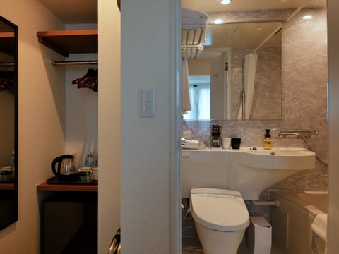 Twin Room, City View | Bathroom | Combined shower/tub, hair dryer, bathrobes, slippers