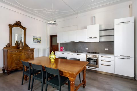 City Apartment | Private kitchen | Electric kettle, cookware/dishes/utensils, dining tables