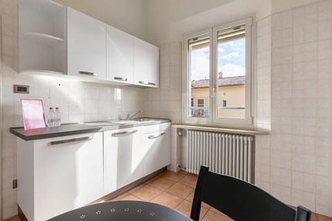 Basic Apartment | Private kitchen | Electric kettle, cookware/dishes/utensils, dining tables