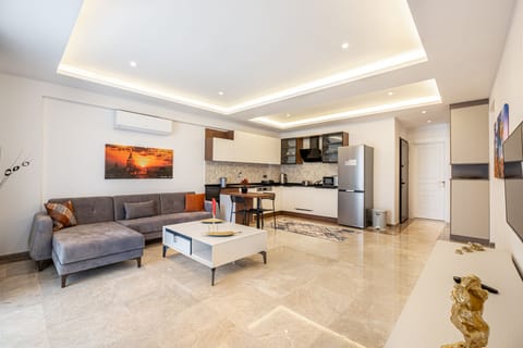 Comfort Apartment, 2 Bedrooms | Living area | 55-inch LED TV with satellite channels