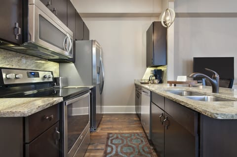 Luxury Suite, 1 King Bed | Private kitchen | Fridge, microwave, oven, stovetop