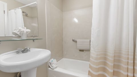 Double Room, Resort View, Beachfront | Bathroom | Combined shower/tub, hair dryer, towels, soap