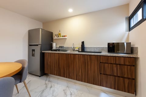 Apartment (404) | Private kitchen | Full-size fridge, microwave, oven, stovetop