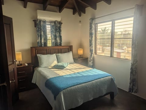 Second guest room, with a queen sized bed