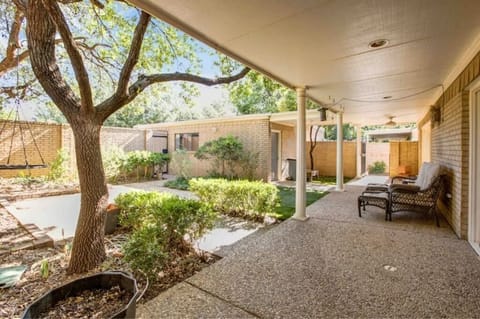Back patio with tree house, trampoline and smoker